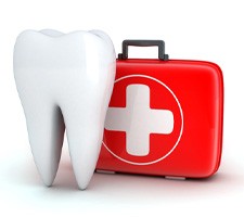 Big white tooth next to red emergency kit 