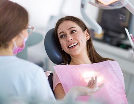 Woman in dental chair smiling