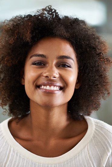 woman smiling after getting dental bonding in Azle