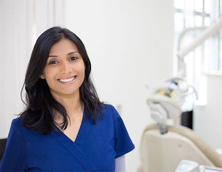 dentist standing in a treatment room