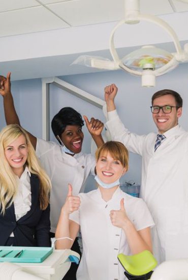 Happy dental patient in treatment chair