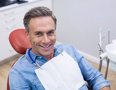 Happy patient relaxing in treatment chair