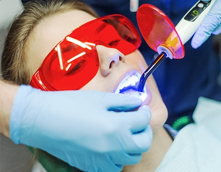 Woman receiving dental bonding