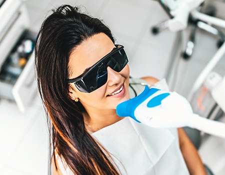 Woman receiving teeth whitening