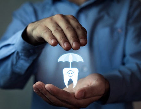 Hands holding a digital tooth with umbrella