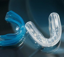 Pair of mouthguards resting on a table