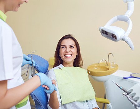 Patient shaking hands with their dentist