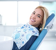 Smiling woman sitting in dental office