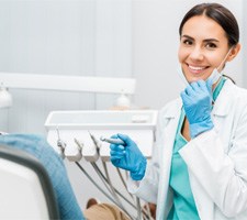 Dentist smiling at patient's dental exam