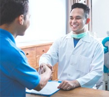 Emergency dentist in Azle shaking hands with patient