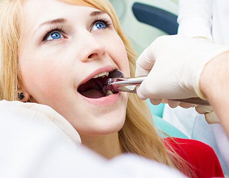 A patient receiving tooth extractions in Azle