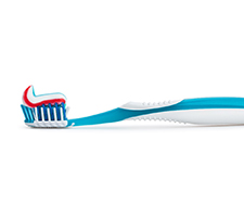 Close-up of blue toothbrush with toothpaste