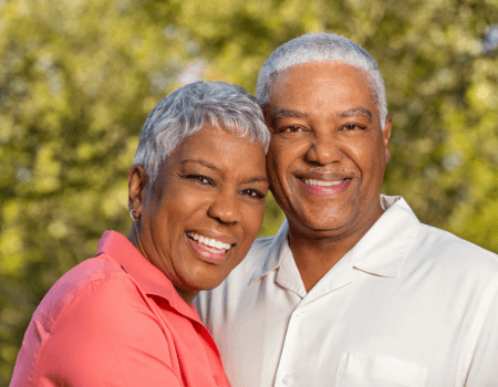 happy elderly couple in nature