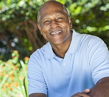 smiling elderly man in a park