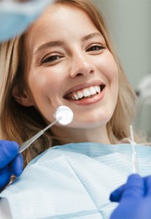 patient smiling while visiting dentist