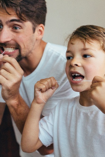 dad and son keeping their teeth healthy with a Medicaid and CHIP dentist in Azle