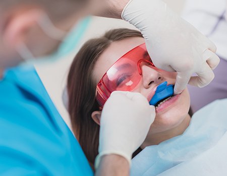 Young girl receiving fluoride treatment