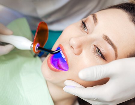 Woman receiving dental sealants