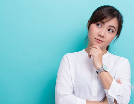 a woman thinking about a full mouth reconstruction in Azle