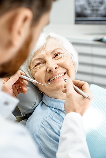 Older woman receiving dental treatment