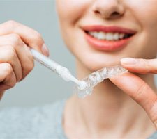 Woman preparing teeth whitening tray