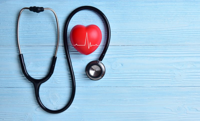 rubber heart nestled inside a stethoscope