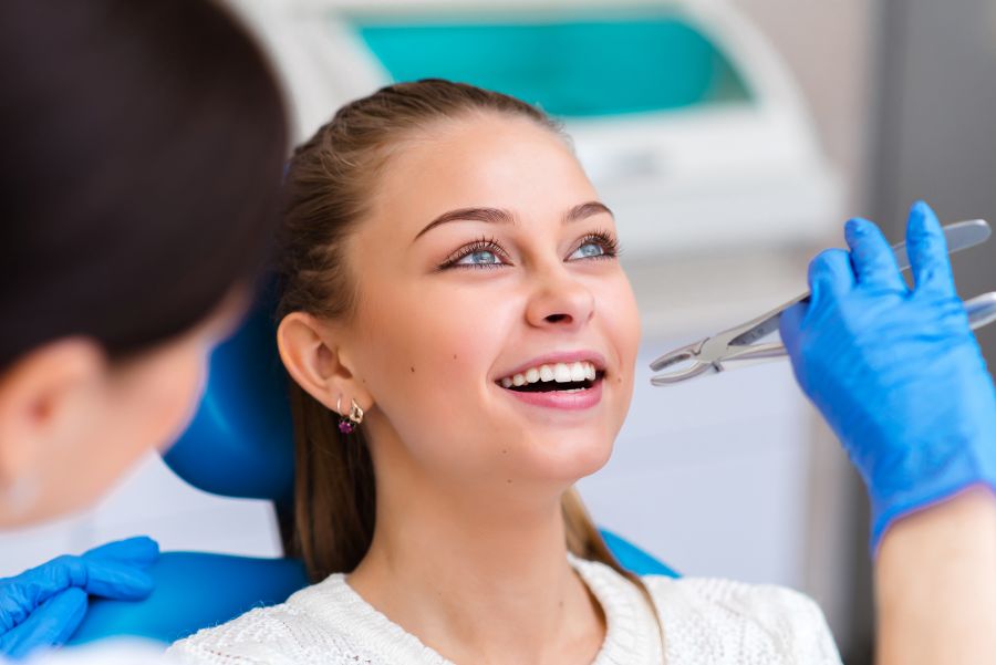 A woman getting a tooth extraction